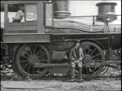 Gif animé d'un homme assis sur un train à vapeur